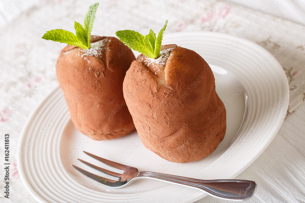 Freshly cooked balls rum cake with mint on a plate. Horizontal
Freshly cooked balls rum cake with mint on a plate. Horizontal