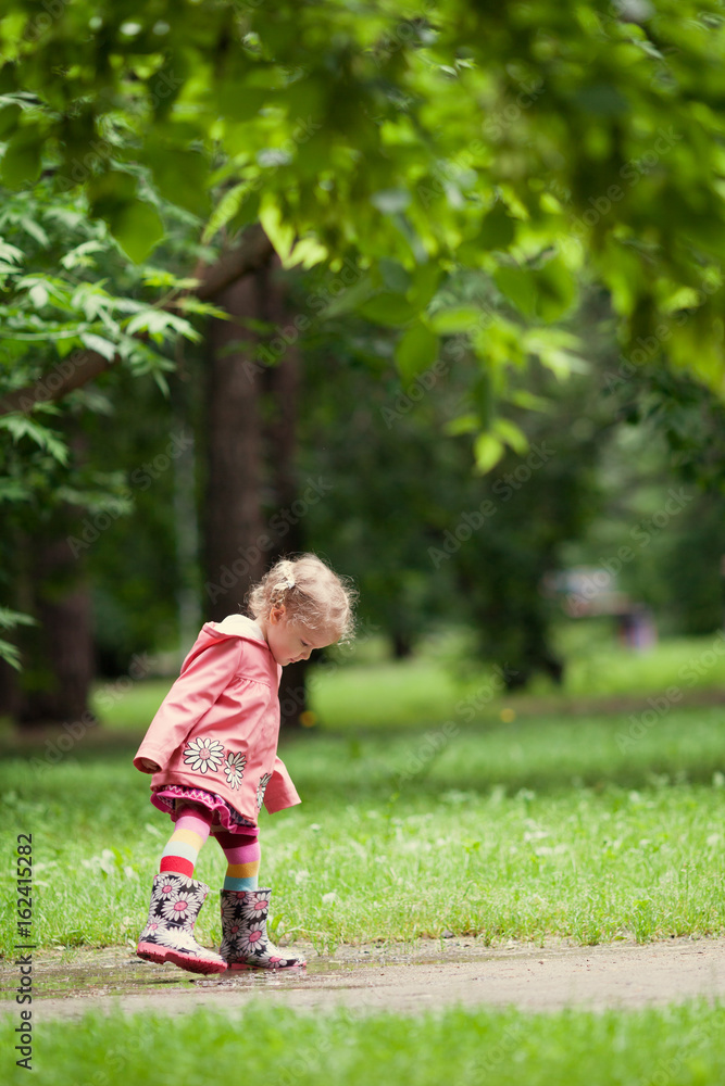 Little beautiful girl walking in a summer park Little beautiful girl walking in a summer park
