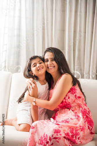 Photography indian smart mother hugging her cute daughter, Portrait of happy Indian mother a