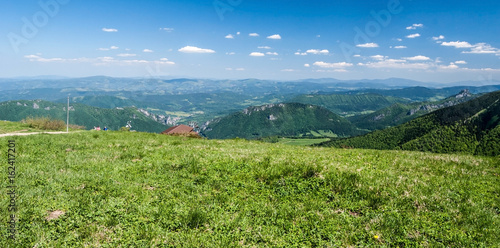 fresh spring mountain meadow with hills on the background in Mala Fatra mountains in Slovakia