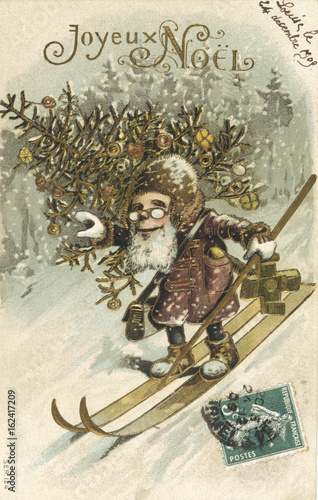 Father Christmas on skis  . Date: 1909 photo