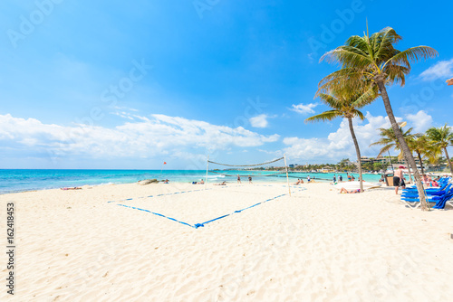 Playa del Carmen - relaxing on chair at paradise beach and city at caribbean coast of Quintana Roo  Mexico