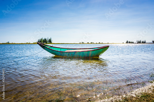 Fototapeta Naklejka Na Ścianę i Meble -  Alone boat in river. HDR