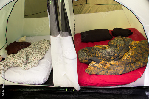 Obraz na plátně Inside of a big family tent - Two cabins with inflatable mattresses for comfort