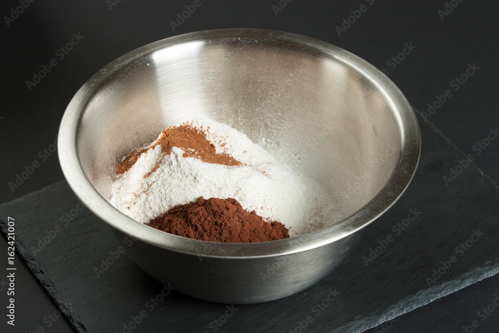 Cooking Process Of Brownies. Ingredients In Bowl. Cooking Process Of Brownies. Ingredients In Bowl.
