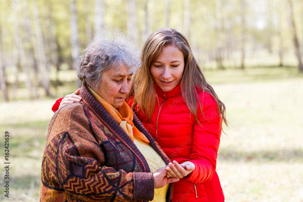 Fototapeta premium Happy elderly woman with her daughter