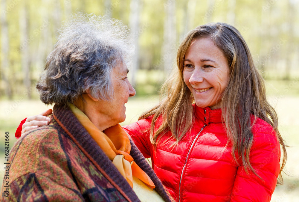 Fototapeta premium Happy elderly woman with her daughter