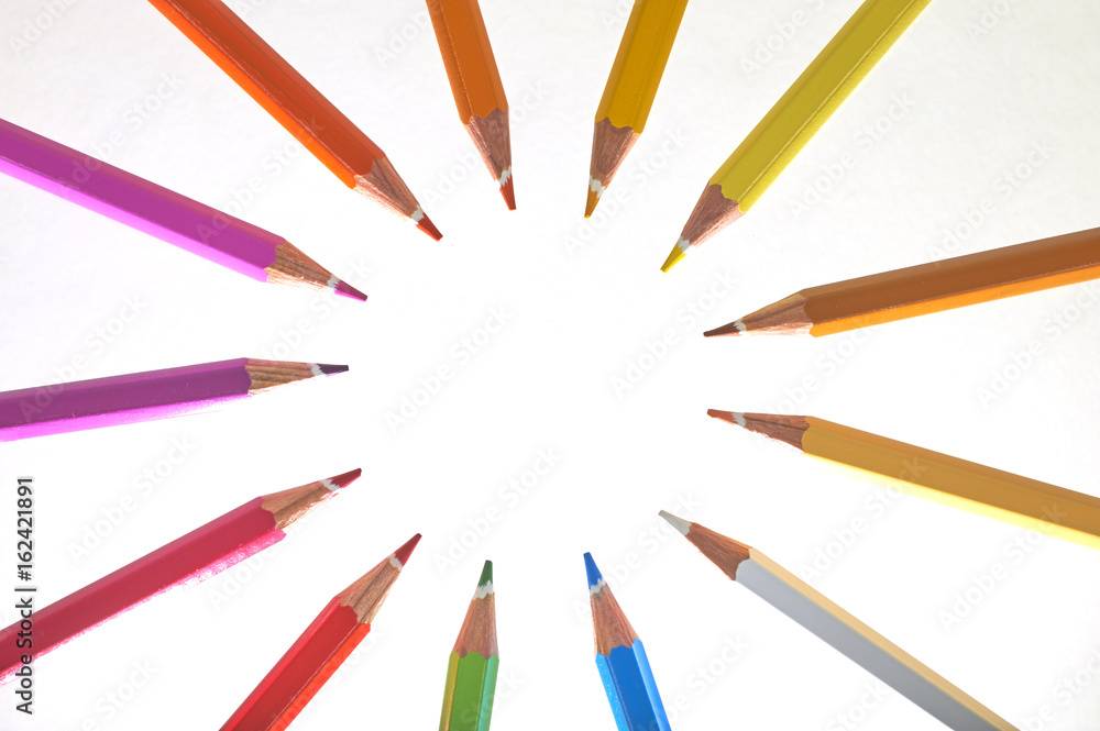 Colorful Wooden Pencils In A Circle Over White Background