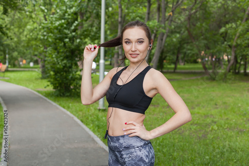 girl during a running session in the summer Park