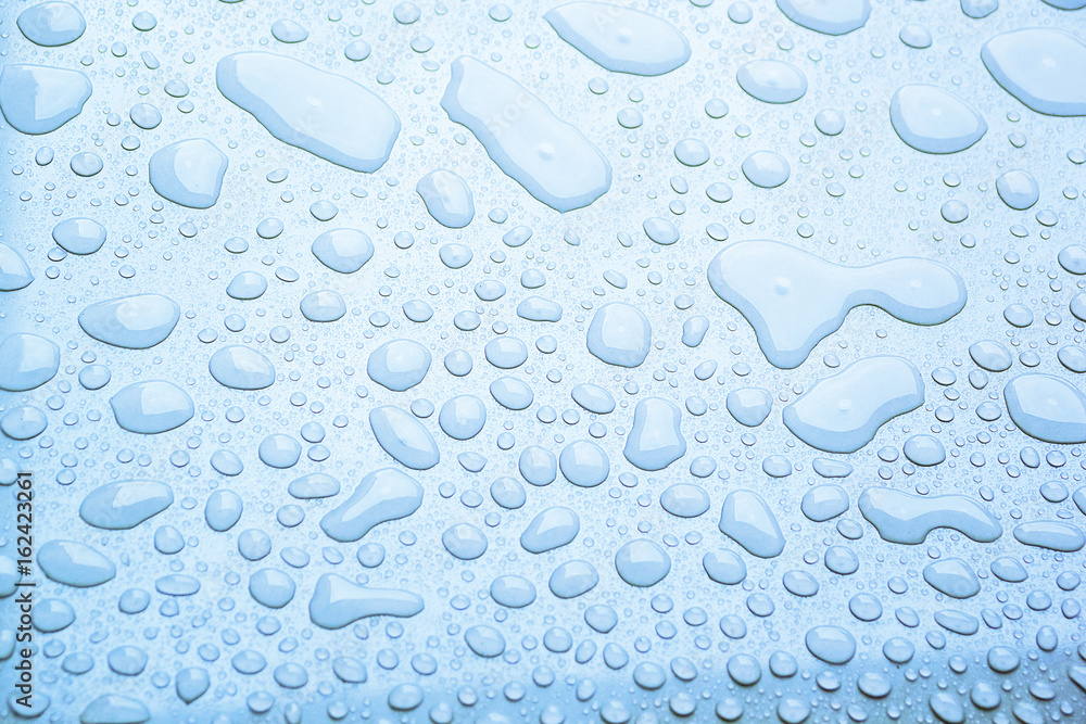 Background of water droplet on the surface in blue color, surface for background
