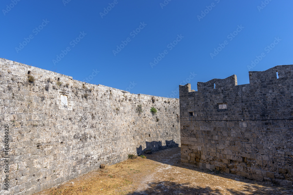 Walls of Rhodes old town and inner moat in the Palace of the Grand Master of the Knights of Rhodes (Kastello), a medieval castle in the city of Rhodes, on the island of Rhodes
