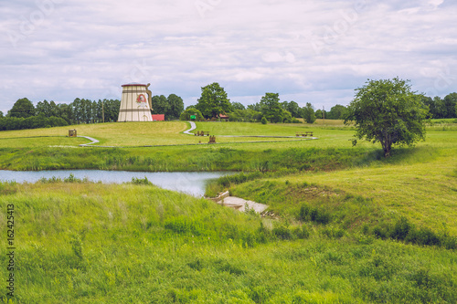 Lake with old Mills  in Dunte, Latvia. Baron Munchausen museum. 2017 photo