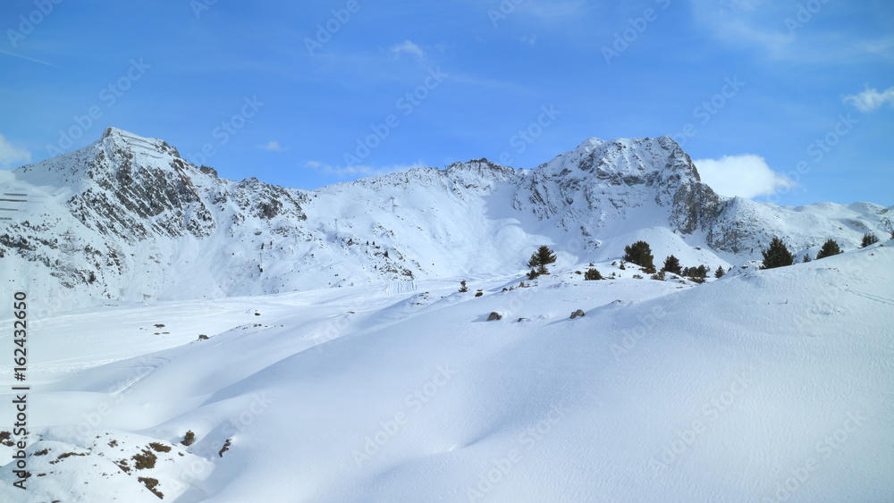 Winter mountain panoramic landscape with fresh snow on skiing tracks, Les Arcs slopes, Alps, France