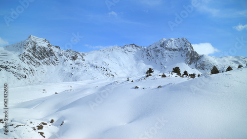 Winter mountain panoramic landscape with fresh snow on skiing tracks, Les Arcs slopes, Alps, France © Yols
