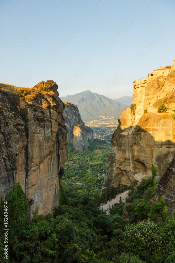 landscape of meteora in the morning with monastery on top of the mountain, Greece