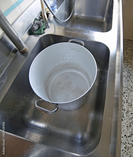 Large industrial sink of a restaurant for washing pots with a la