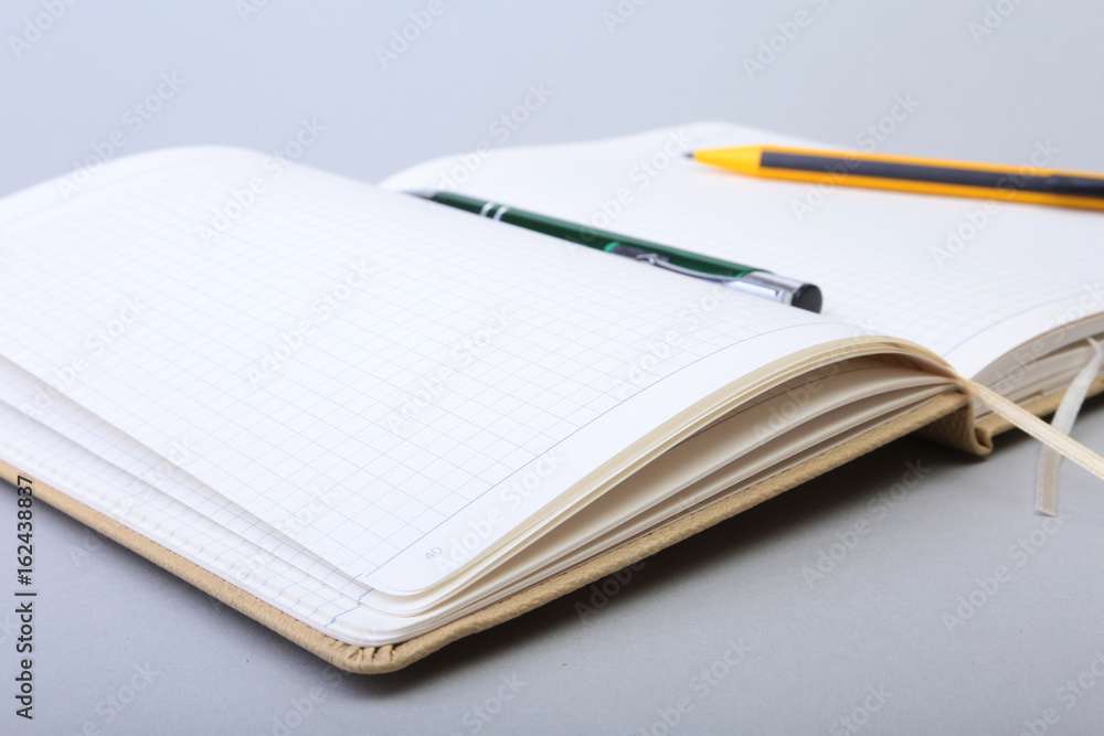Open Blank Page notebook and pen on white table. Open Blank Page notebook and pen on white table.