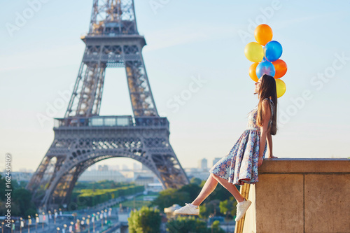 Young woman with bunch of balloons near the Eiffel tower © Ekaterina Pokrovsky