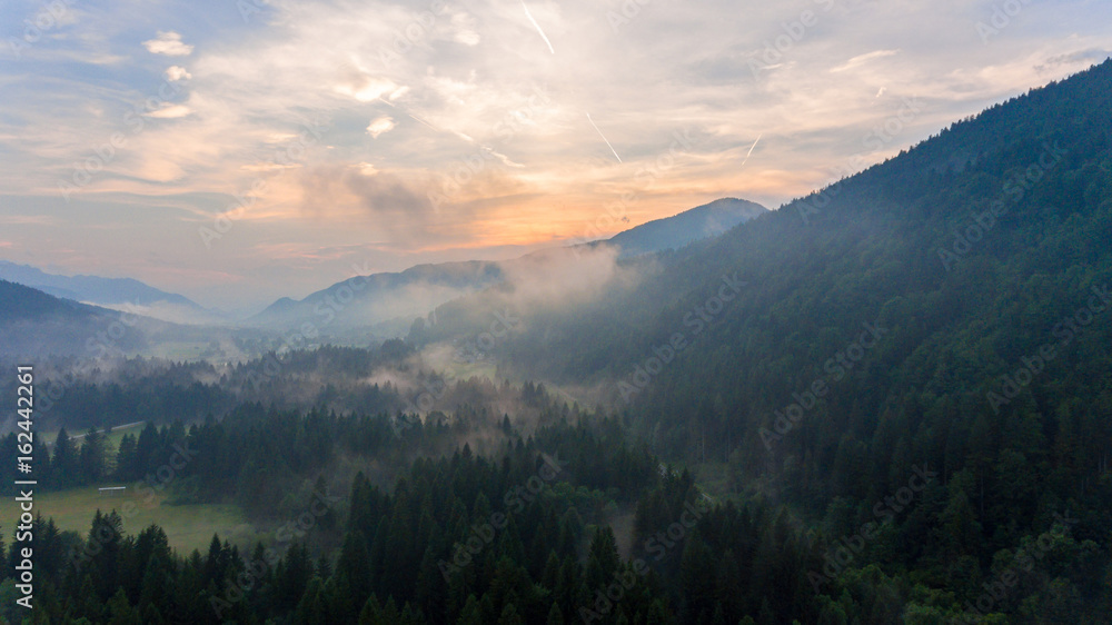 Fototapeta premium Aerial view of sunrise over a valley.