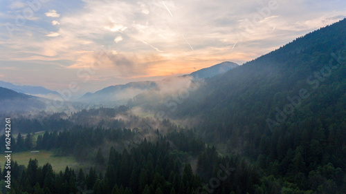 Aerial view of sunrise over a valley.