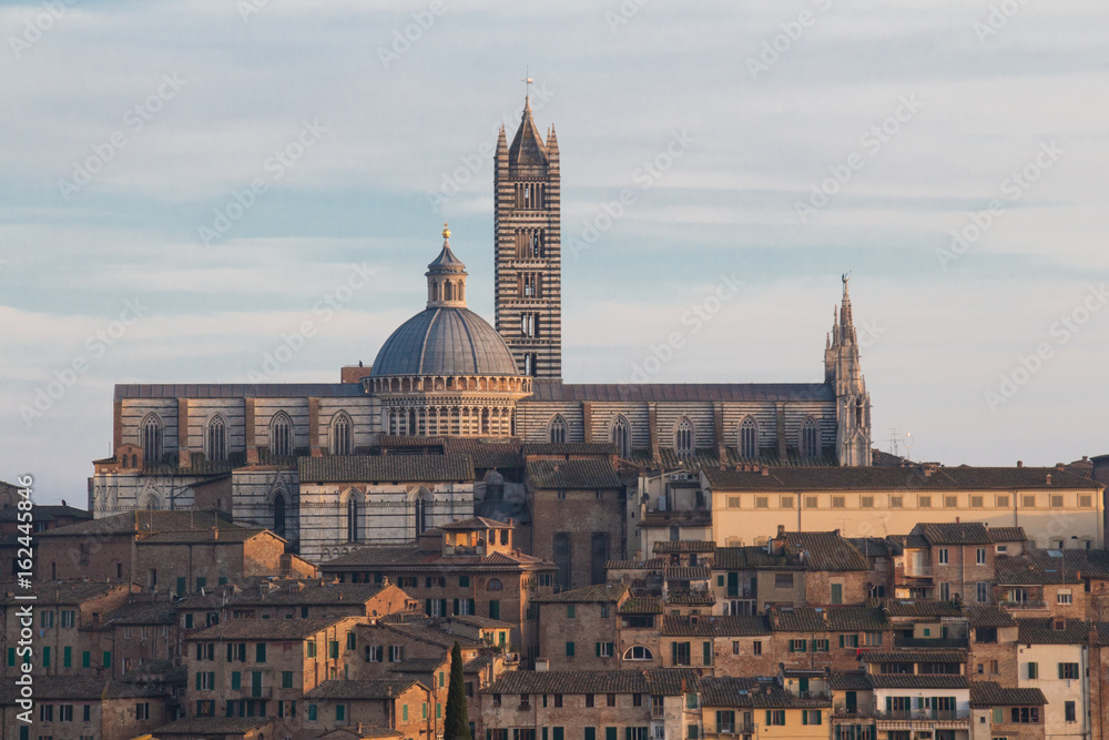 View of Duomo di Siena or Metropolitan Cathedral of Santa Maria Assunta from north. Tuscany. Italy.