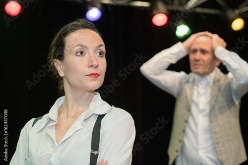 male and woman theatre actors on stage