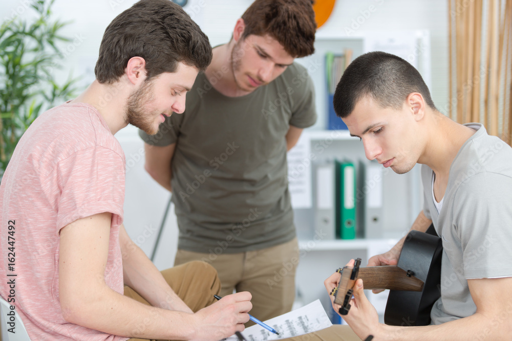 Obraz premium young men composing music at home