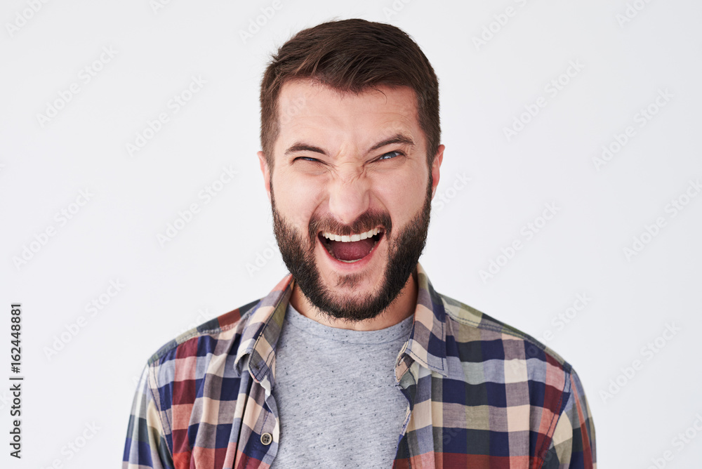 Screaming emotional young bearded man posing Screaming emotional young bearded man posing