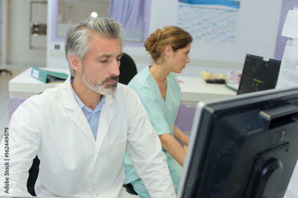 doctors and nurse analyzing medical test doctors and nurse analyzing medical test