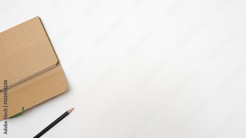 note book and pencil copy space on white background note book and pencil copy space on white background