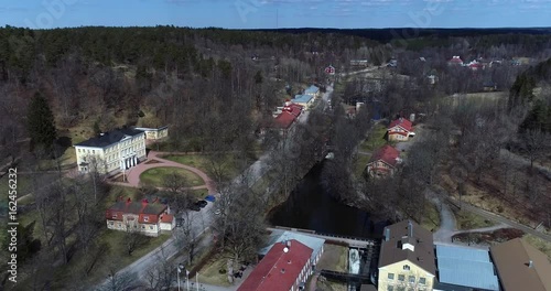 Fiskars village, Cinema 4k aerial view over fiskari steelworks, at a sunny spring day, in Raasepori, Uusimaa, Finland photo