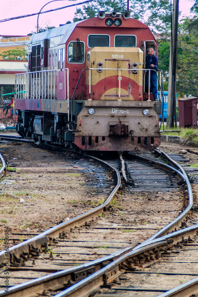 CAMAGUEY, CUBA - JAN 25, 2016: Train engine in the railway station in Camaguey CAMAGUEY, CUBA - JAN 25, 2016: Train engine in the railway station in Camaguey
