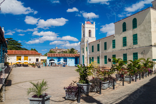 Vászonkép CAMAGUEY, CUBA - JAN 25, 2016: Colorful houses at San Juan de Dios square in Cam