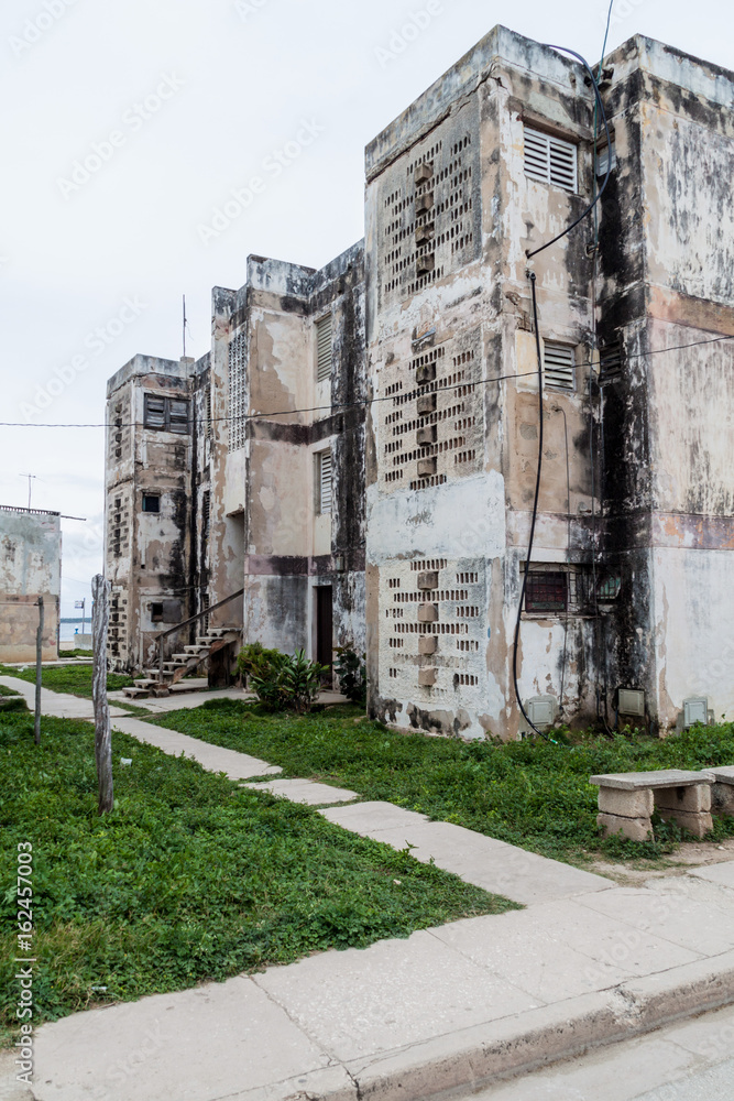 Dilipitated concrete block of flats in Gibara village, Cuba