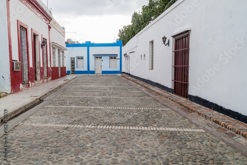 Small cobblestoned street in the center of Bayamo, Cuba photo