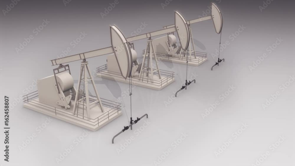 three oil jacks in a row working on the white background, with copy space three oil jacks in a row working on the white background, with copy space