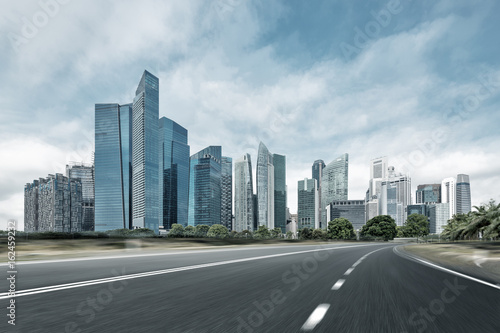 Canvas Print empty road with modern buildings