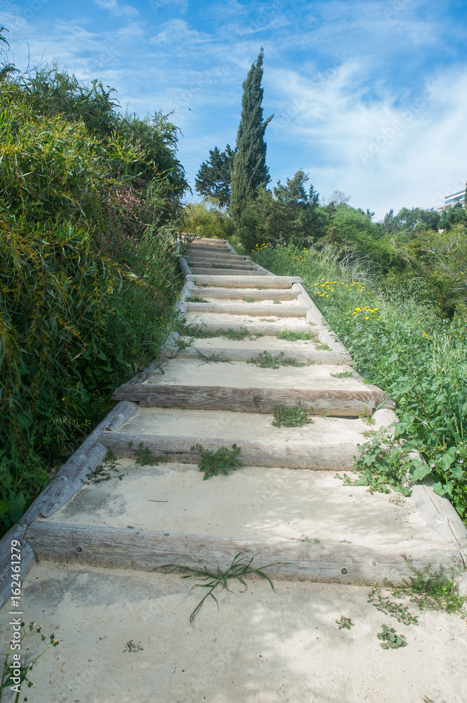 A picturesque, natural staircase upstairs, against the blue sky. The concept of success, leadership. Cyprus. Cape Greco. Ayia Napa A picturesque, natural staircase upstairs, against the blue sky. The concept of success, leadership. Cyprus. Cape Greco. Ayia Napa