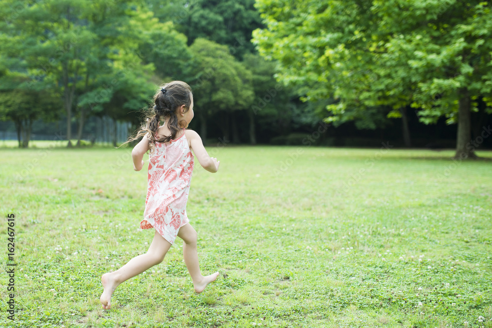 Happy Little Girl running barefoot