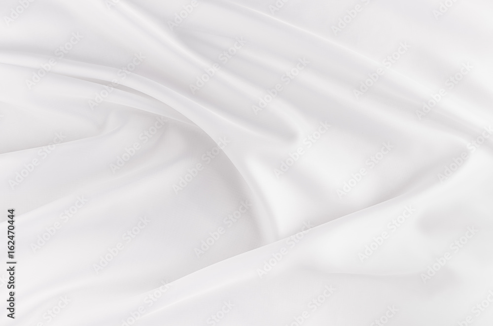 White smooth elegant silk or satin fabric texture with liquid wave. White smooth elegant silk or satin fabric texture with liquid wave.