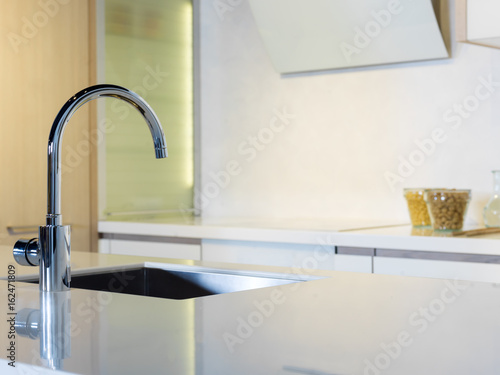 Modern crane with flowing reflection on toughtened glass.