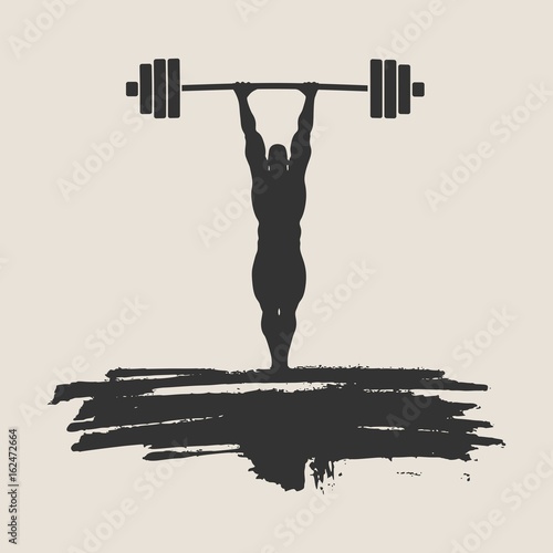 Bodybuilder and barbell silhouettes. Bodybuilder posing on grunge brush stroke.