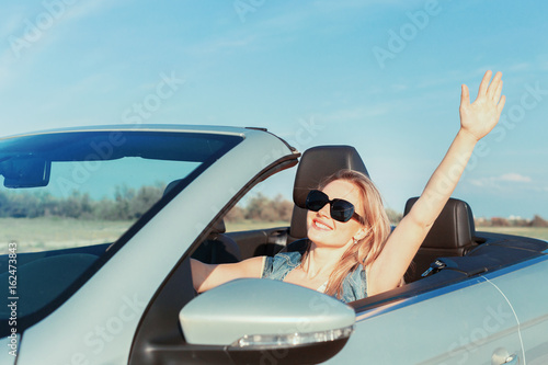 Relaxed happy woman traveling in a car © fotofabrika