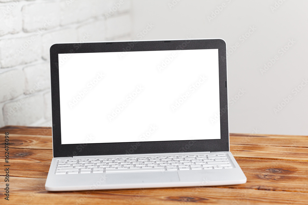 laptop blank screen on wooden table laptop blank screen on wooden table