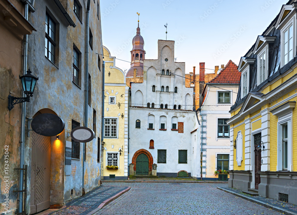 Medieval buildings in center of old Riga - the capital of Latvia and a famous Baltic city known among tourists due to its unique medieval and Gothic architecture