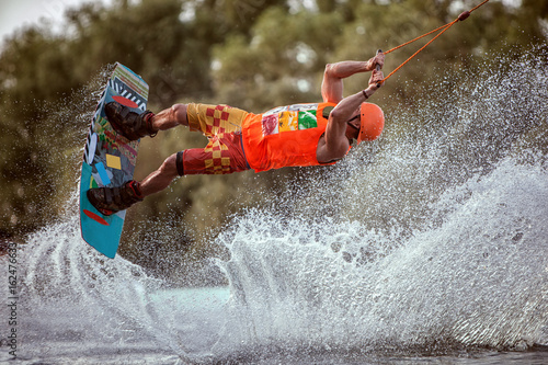 Extreme jumps on the board on the water. A lot of splashes and splashes of water.