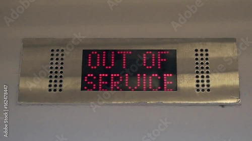 Blinking sign out-of-service on the display of an elevator