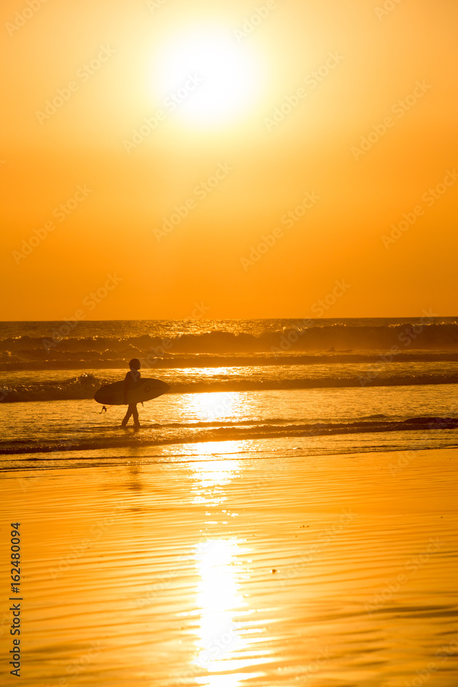 Surfers at Sunset in Santa Teresa, Costa Rica