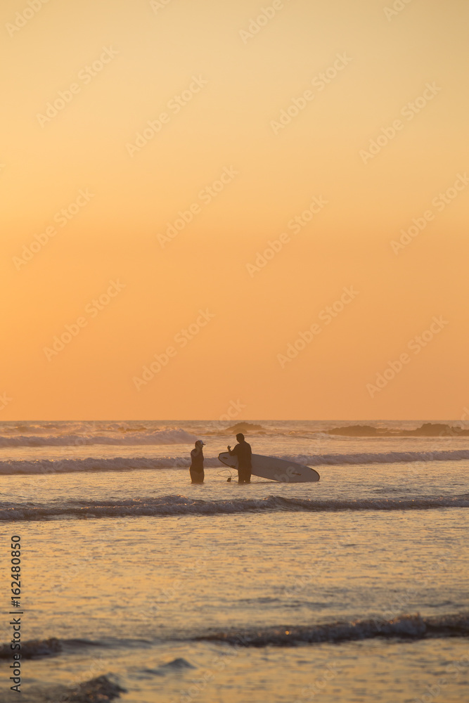 Surfers at Sunset in Santa Teresa, Costa Rica