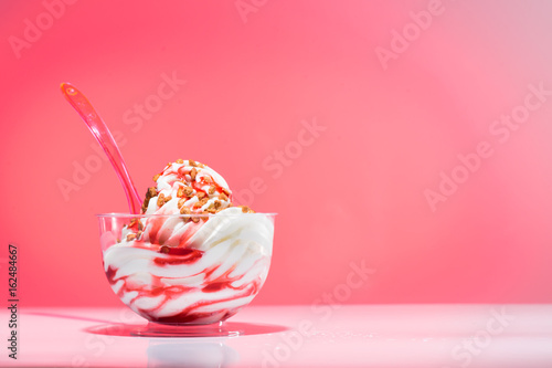 plastic cup of an strawberry sundae photo